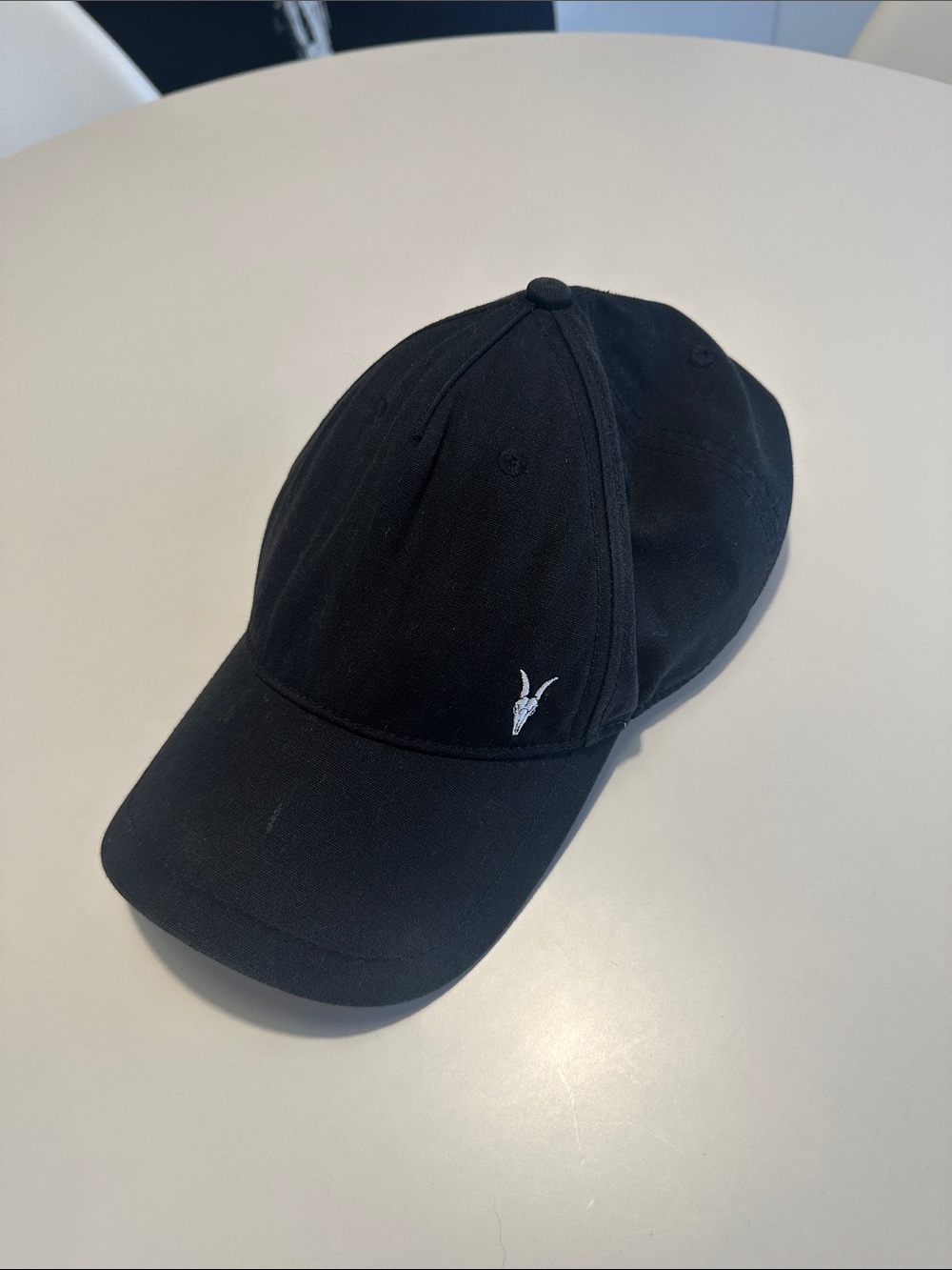 AllSaints Black Cap with Small White Ram Logo